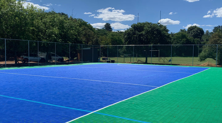 Self‑Draining Sports Flooring: Say Goodbye to Water Damage and Downtime
