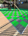 Black and green playground mats