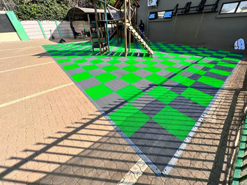 Black and green playground mats